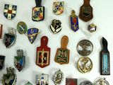 many different types of badges on a white surface