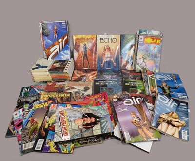 a lot of comic books sitting on a table
