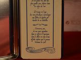 a small box with a poem on it sitting on a table
