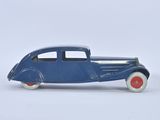a blue toy car that is sitting on a white surface