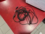 a red table with a bunch of wires on top of it