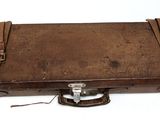 an old suitcase that is sitting on a white surface