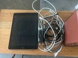 a tablet computer and a cell phone on a table