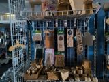 a wire rack with various items on it in a room
