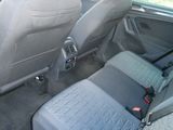 a seat in the back of a car with a seat belt