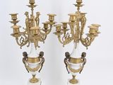 pair of antique brass and glass candelabs on pedestals