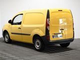 the yellow van is parked on the checkered floor in the room