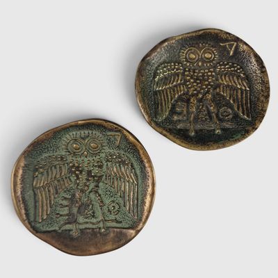 two bronze buttons depicting an owl and a tree