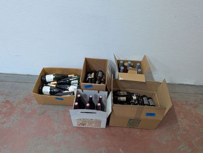 many boxes of bottles of wine sitting on the floor