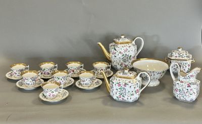 many different types of teapots and cups on the table