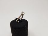 an image of a diamond ring sitting on top of a black box