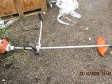 a picture of a lawn mower with a string attached to it