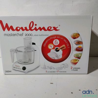 the box of a food processor is sitting on the table