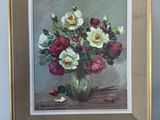 une peinture de fleurs dans un vase sur un chevalet