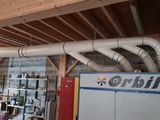 a picture of a room that has a bunch of pipes on the ceiling