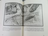 an open book with a drawing of a bird on it