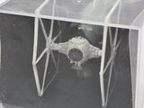 a plastic box with a star wars tier model inside of it
