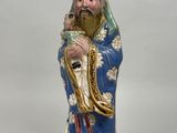 an image of a figurine of a man with a beard holding a pipe