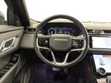 the interior of a car with a steering wheel and dashboard controls