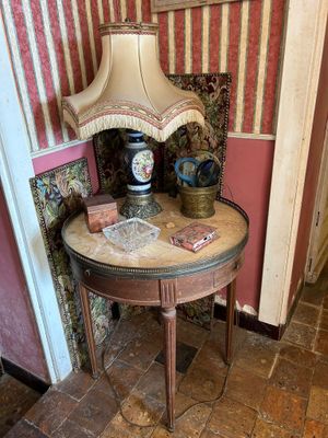 a small table with a lamp on top of it
