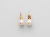 a pair of pearl earrings on a white background