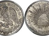 a close up of a coin with a bird on it