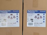 two boxes are stacked on top of each other with labels on them