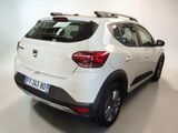 the rear end of a white car with a black roof rack