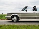 a silver car that is parked on the side of the road