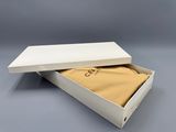 a white box with a yellow shirt inside of it