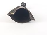 an image of a small metal object on a white surface