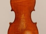 an old violin with a wooden back and a long neck