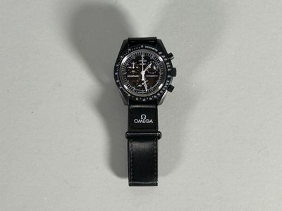 a watch that is sitting on a white surface