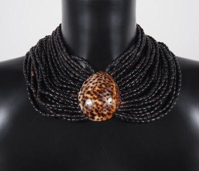 a close up of a mannequin wearing a leopard print necklace