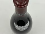 a bottle of wine that is sitting on a table