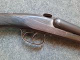 a close up of a gun that is on the ground
