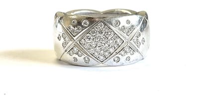 a close up of a diamond ring on a white surface