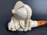 a white pipe with a helmet on top of it