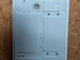 a picture of a white electronic device on a wooden surface