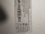 two tags on the back of a laptop computer