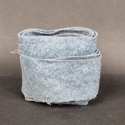 two pieces of blue fabric sitting on top of each other