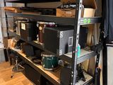 a shelf with many different types of electronics on it
