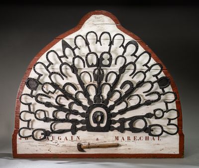 many pairs of scissors on display in a display case