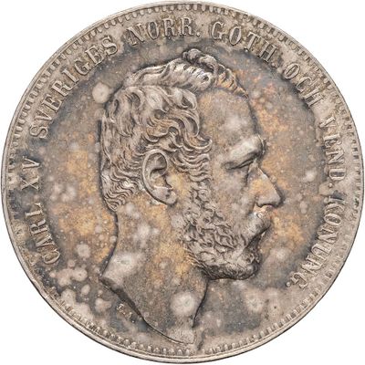 an old silver coin with a portrait of a man on it