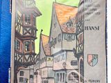 a picture of a book with a picture of a town on it