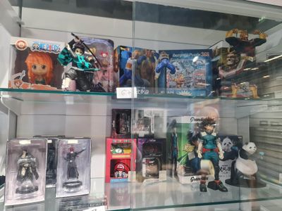 a glass display case filled with action figures and action figures