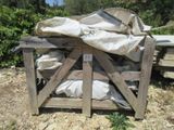 a pile of bags sitting on top of a wooden crate
