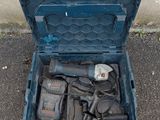 a blue tool box with tools in it on the ground