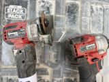 two power tools that are sitting on a wall