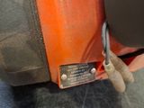 a close up of a person ' s hand cutting a piece of metal